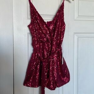 Venus, Ruby colored sequenced and tie romper